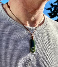 100% Genuine Natural Untreated Nephrite Jade Pendant with Waterproof Polyester Wax Cord Adjustable Necklace.  You can wear it 24/7, ideal for all life styles. This hand carved Māori Style Fish Hook Nephrite Jade Pendant with beautiful dark green colour! It represents good luck and safe travel across water. Men's , Women's, Kids Necklace. Pendant size :  H: 40mm W: 15mm Thickness: 5mm Selection of 1.5mm Waterproof Strong Durable Black, Brown, Light brown, Red or White Polyester Wax Cord Adjustable from 14~ 28 inches Choker Necklace. This natural nephrite jade pendant is a very good choice to treat yourself with something very special & precious or a fantastic gift to your loved one. Wedding, Birthday .Mother's Day Gift ideas, Father's Day Gift.  Jade (Prosperity - Good Luck -Wisdom) is a sy Dark Green Colour, Jade Necklace Pendant, Fish Hook Necklace, Hook Necklace, Mori Fashion, Life Styles, Nephrite Jade, Kids Necklace, Necklace Green