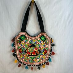 Banjara Ethnic Boho Bright Embroidered & Beaded Shouldertote With Tassels With Approximately 16 Inches Length Approximately 14 Inches Shoulder Drop Approximately 12 Inches New Without Tags Traditional Shoulder Bag With Multicolor Embroidery And Tassels, Traditional Multicolor Embroidered Shoulder Bag With Tassels, Traditional Festive Bags With Tassels, Traditional Multicolor Bags With Tassels, Traditional Tote Shoulder Bag With Tassels, Traditional Shoulder Bag With Tassels For Daily Use, Everyday Festival Bags With Tassels, Traditional Yellow Shoulder Bag For Daily Use, Multicolor Embroidered Rectangular Shoulder Bag With Tassels