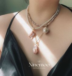 This pendant showcases a captivating gold-flecked baroque pearl, with its natural, unique shape and delicate gold specks, ensuring every piece is one of a kind. The pendant clasp can be opened for added versatility. Paired with a classic white pearl necklace, the combination creates a timeless and elegant contrast. Complete your look with matching earrings from the collection. Composition: Gold Filled/pearl/zircon Handle Gently: Avoid contact with perfumes, cosmetics, and harsh chemicals. Show L Baroque Pearl Jewelry With High Luster, High Luster Baroque Pearl Jewelry, Baroque Pearl Jewelry With Pearl Charm, Luxury Baroque Pearl Necklaces, Unique Pearl Necklaces With Pearl Pendant, Luxury Baroque Pearl Pendant Jewelry, Gold Necklace With Pearl Charm, Unique Gold Pendant Pearl Necklace, Unique Gold Necklace With Pearl Charm