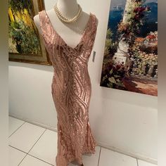 Gorgeous Night Way Formal Rose Gold Sequin V Neck Gown Size 6 Lon Back Zipper , Fully Lined , See Through Sides With Fabric Cover ! Bust Is 18 Inches Across Waist Is 15 Inches Across Lenght Is 60 Inches Long New With Tags! Pink V-neck Sequin Evening Dress, Glamorous Pink Gown For Night Out, Pink V-neck Evening Dress For Night Out, Glamorous Floor-length Dress For Wedding Night, Glamorous Floor-length Wedding Night Dress, Pink V-neck Party Gown, Pink Gown For Wedding Night, Pink Fitted Dress For Wedding Night, Pink V-neck Gown With Sequins