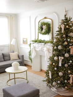 a living room with a christmas tree in the corner