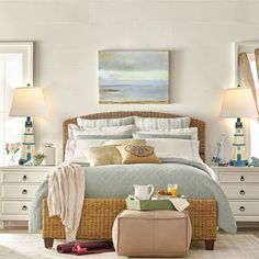 a bedroom with wicker furniture and white walls