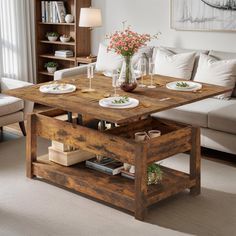 a living room filled with furniture and a wooden table