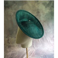 One hat base with a 3.75" tall upturned brim made in teal green stiffened sinamay straw that measures approximately 11" (27.94 cm) in diameter at the top. The base is contoured to fit against the head. The edges of the brim are finished in sinamay. The multi-layer stiffened sinamay straw has a great sturdy weave and provides excellent support for your millinery creations. This is NOT a ready to wear  finished hat and it will not stay on your head unless you add a head band to wear it. This base does have a small sleeve sewn into the crown that will accomodate headbands listed separately in my shop. Add embellishments of your choice. A nice high quality base - I know you'll be pleased! This hat base is listed separately in other colors. Check my listings for available options... Lots of hat