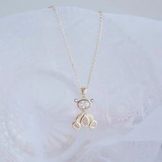 This beautiful 100% Chrystal Teddy Bear is designed to brighten your life and add some much needed sparkle to your closet. Shine bright like a diamond and accessorize like a pro. This beautiful necklace sits beautifully on any neckline, wear as a clavicle necklace or center on your breastbone. This Teddy Bear goes perfectly with any outfit or style and moves when you move - with ease. Made with extreme attention to every detail and facet, this beautiful flawless-cut teddy bear will bring complet Gold Jewelry With Rhinestones For Birthday, Diamond White Cubic Zirconia Crystal Necklace As Gift, Diamond White Rhinestone Necklace As Gift, Sparkling Clear Jewelry For Gifts, Sparkling Clear Jewelry Gift, Gold Cubic Zirconia Necklace For Birthday, Diamond White Jewelry For Birthday, Crystal Necklace With Sparkling Stones For Gift, Cubic Zirconia Necklaces For Mother's Day Party