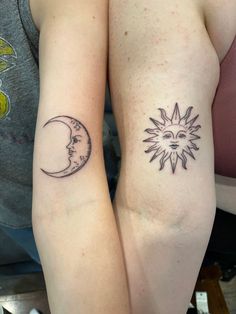 two sun and moon tattoos on both arms