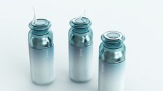 three empty water bottles are shown on a white background, one is blue and the other is silver