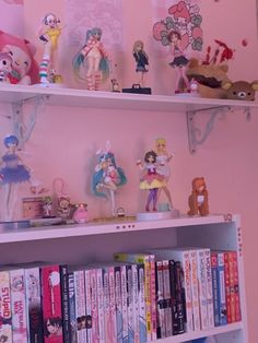 there are many dolls on the shelves above the bookshelf in this children's room