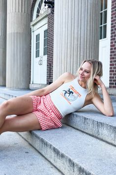 It’s no secret white tanks have been around forever, but this time around, simple white tanks are having their comeback moment. It's the perfect combination of classic and cute with our unique college graphic and western inspired design. With details only students could understand, our designers have done their research to find unique trends and traditions specific to University of Tennessee. This is the perfect fashionable, trendy Tennessee top. Fit: Fitted, double lined so it is NOT see throug Casual Summer Tank Top For College, Cotton Tank Top For College In Summer, White Sleeveless Preppy Top, White Tops For College Events In College Style, White Tops For College Events, Casual White Tops For College Events, White Tanks, 130 Pounds, University Of Tennessee