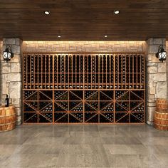 an empty wine cellar with several wooden barrels