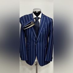 Blue Super 150 Cerruti 1881 Pinstripe Wool Suit Made In Italy Notch Lapel Light Weight Wool Soft Neapolitan Shoulders Ticket Pocket Hand Stitched Double Vent Flat Front Pant 8-9 Inch Leg Opening Functional Sleeve Button Linning Not Canvas Offered At Wholesale Price Allow 5-7 Days Shipment From Our Italian Warehouse You Will Not Find A Suit At This Price Point Anywhere. Period This Collection Will Exceed Your Expectations Compare With Other Luxury Brands Like Zegna, Armani, Hugo Boss, Ralph Laure Elegant Striped Formal Sets, Striped Business Sets, Classic Striped Formal Sets, Luxury Striped Fitted Suits, Blue Pinstripe Suit, Ralph Laure, Cerruti 1881, Flat Front Pants, Pinstripe Suit