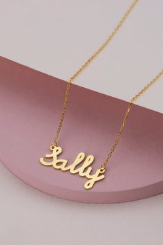 14k 18k 10k Solid Gold Minimal Gold Name Necklace, Custom Word Necklace, Personalized Name Jewelry for Women, Birthday Gift for Mom FEATURES• Solid Gold (real gold, not gold plated or gold filled material)• Gold Karat: 10K (417) - 14K (585) - 18K (750) (optional)• Pendant Height: 0.35 Inches (0.90 cm)• Pendant Width: depending on the text• Available Gold Color: Yellow gold, rose gold and white gold (optional)Wholesale requests are welcome.Our gold necklaces are perfect choice for a Christmas, Mo Gold Plated Name Necklace For Valentine's Day, Valentine's Day Gold Plated Name Necklace, Custom Name Yellow Gold Necklace As Gift, Gold Hallmark Nameplate Necklace, Gold Nameplate Necklace With Hallmark, Gold Hallmarked Nameplate Necklace, 14k Stamped Nameplate Necklace For Anniversary, 14k Yellow Gold Name Necklace With Hallmark, Gold Nameplate Necklace For Birthday