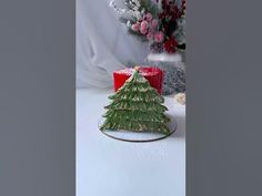 a small christmas tree sitting on top of a table