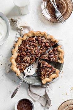 a pecan pie on a plate with two forks