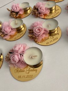 wedding favors with candles and flowers on them for guests to use as place cards or centerpieces