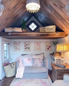 a living room filled with lots of furniture and decor on top of a wooden ceiling