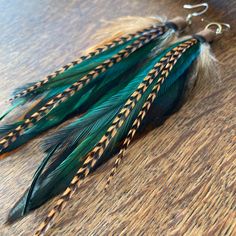 Green Feather Earrings Real Feather Earrings Free spirited one of a kind boho feather earrings.     Handmade with layers of green and  turquoise blue emu feathers with soft brown grizzly saddle feathers and natural copper and black roosters feathers, set in leather on surgical steel ear wires. Measures 5 inches/ 14cm including the ear wires.  Click here for more feather earrings: https://www.etsy.com/au/shop/heidihaha?ref=si_shop Green Bohemian Earrings With Feathers, Green Bohemian Feather Earrings, Bohemian Green Feather Earrings, Green Feather Earrings As A Gift, Christmas Presents For Women, Black Rooster, Green Feather, Handmade Boho Jewelry, Rooster Feathers