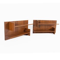 two wooden shelves sitting next to each other