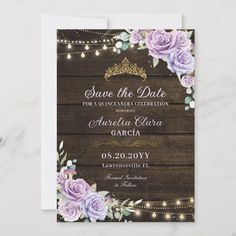 save the date card with purple roses and string lights on it, in front of a wooden