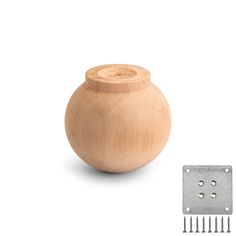 a small wooden vase with screws on the side and a metal object next to it