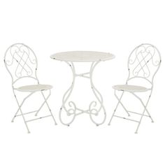 an outdoor table and two chairs with white wrought iron design on the back, against a white background