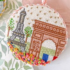 an embroidered purse with the eiffel tower in paris on it's side