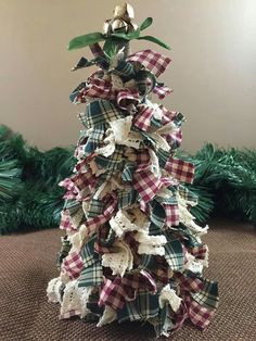 a small christmas tree made out of fabric