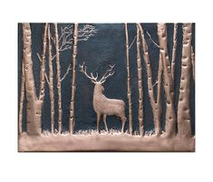 a metal wall hanging with a deer in the woods on it's side and trees behind it