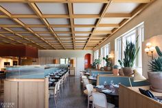 an empty restaurant with many tables and chairs