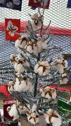 a christmas tree decorated with cotton balls and tinsel