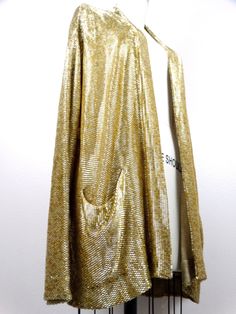 "This is a rare and absolutely gorgeous vintage piece! It's heavily embellished with gold beading and in perfect condition! Measurements are taken with the front brought together. There are no closures. Please note, this piece weighs just over 5 lbs. Bust - 48\" Shoulders - 22\" (hem to hem) Sleeves - 24\" Length - 29\" (top hem to bottom hem) Size - there's no tag size, but fits like an oversized Extra Large All of my items come from a smoke-free and pet-free home. If you have any questions, pl Festive Gold Evening Outerwear, Festive Gold Outerwear For Fall, Gold Cardigan For Winter Party, Gold Cardigan For Fall Party, Vintage Gold Outerwear For Fall, Fitted Gold Cardigan For Fall, Elegant Gold Cardigan For Winter, Elegant Gold Outerwear With Sequins, Gold Sequined Outerwear For Winter