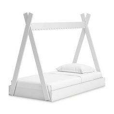 a white bed frame with two pillows on the bottom and one pillow in the middle