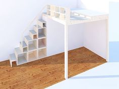 a room with a book shelf and stairs in the corner, next to a white wall