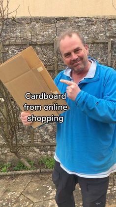 a man holding a cardboard box and pointing at it with the words cardboard from online shopping