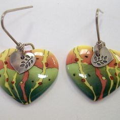 Parrot Heart Ceramic Dangle Earrings. Handcrafted In The Ancient Technique Of Millefiori, Porcelain. Vibrant Shades Of Orange & Green. The Perfect Gift For Someone Special To Your Heart. Unique Artisan Pierced Earrings Approx 1 3/8". New With Tag. 142 106 822 Heart-shaped Hand Painted Earrings As Gift, Hand Painted Multicolor Heart Earrings For Gift, Hand Painted Multicolor Heart Earrings As Gift, Hand Painted Heart Earrings For Gift, Multicolor Enamel Heart-shaped Jewelry, Multicolor Enamel Heart Jewelry, Multicolor Heart-shaped Enamel Jewelry, Multicolor Heart-shaped Hand Painted Earrings, Hand Painted Multicolor Heart Earrings