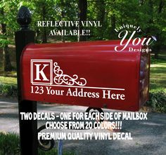 a mailbox with the words k and your address here on it is in front of some trees