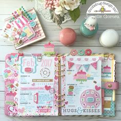 an open planner book with lots of things on the page and decorations around it,