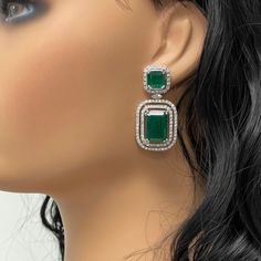 The Renee Emerald & Diamond Earrings are a unique and luxurious heritage pair with royal green emeralds and diamonds set in white gold. Gemstones Type: EmeraldGemstones Shape: RectangularGemstones Weight: 25.01 ctGemstones Color: Green Diamonds Shapes: Round & Marquise Total Diamonds Weight: 3.01 ctDiamonds Color: H - J Diamonds Clarity: VS - SI (Very Slightly Included - Slightly Included) Metal: 14K Gold Metal Wt: 17.4 gms Setting: Prong Set Price Quoted may be negotiable. Please contact us to Real Gemstone Jewelry, Diamond And Emerald Earrings, Green Emerald Cut Diamond Earrings For Formal Events, Green Diamond Earrings With 17 Jewels For Formal Events, Green Diamond Earrings With 17 Jewels For Formal Occasions, Emerald Cut Green Diamond Earrings For Formal Events, Green Diamond Earrings For Parties, Green Hand Set Diamond Earrings, Diamond Green Bridal Earrings For Anniversary