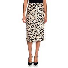 Skirt Color ChoicesLeopard - Shiny warm wheat brown undertone with true black spotsSkirt SizingFit: Form-fits through hipsHemline: Straight; lands near or below-the-kneeModel Notes: Model in Leopard is 5'7" with a 32" bust and 25" waist; wearing size XSSize Guide: View the Size Chart to determine your size and how to measureSkirt DetailsFabric Content: Made of 100% polyesterCare Instructions: Machine wash/Tumble dryCountry of Origin: ChinaPlease see the Garment Measurements tab for the actual me Long Leopard Print Skirt For Spring, Leopard Print Long Skirt For Spring, Casual Leopard Print Midi Skirt Bottoms, Casual Leopard Print Midi Skirt, Flowy Leopard Print Skirt For Spring, Spring Leopard Print Midi Skirt, Chic Leopard Print Skirt For Spring, Casual Midi Length Pencil Skirt For Night Out, Chic Midi Length Viscose Skirt