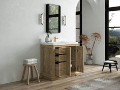 a bathroom with a sink, mirror and stool next to a bathtub in the room