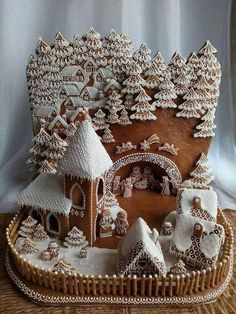 an elaborate gingerbread house is displayed on a table