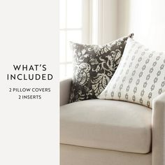 a couch with pillows on it and the text what's included? 2 pillow covers 2 inserts