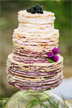 a stack of pancakes sitting on top of each other next to a cell phone screen