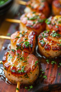 some food is being served on skewers with toothpicks and garnishes