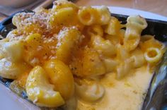 macaroni and cheese is served on a white plate