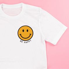 Bistec Happy Face T-Shirt Cute White T-shirt With Smiley Face, White Graphic Tee With Smiley Face, White Smiley Face Graphic Tee, White Relaxed Fit Top With Smiley Face, White Smiley Face Top With Relaxed Fit, White Smiley Face Crew Neck Top, White Crew Neck Top With Smiley Face, Smiley Face Yellow, Ice Shirt