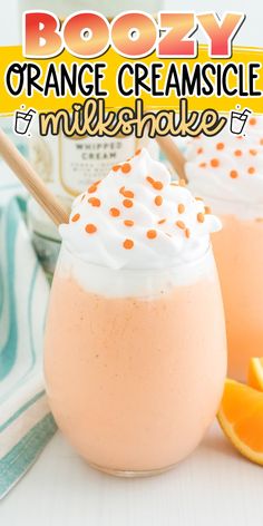 boozy orange creamsice milkshake with whipped cream and sprinkles