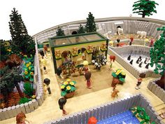 a lego model of a pet shop with dogs, cats and other animals in it