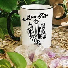 a coffee mug that says crystal mama on it with crystals around it and the words