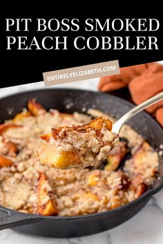 a skillet with oatmeal in it and the words, pit boss smoked peach cobbler